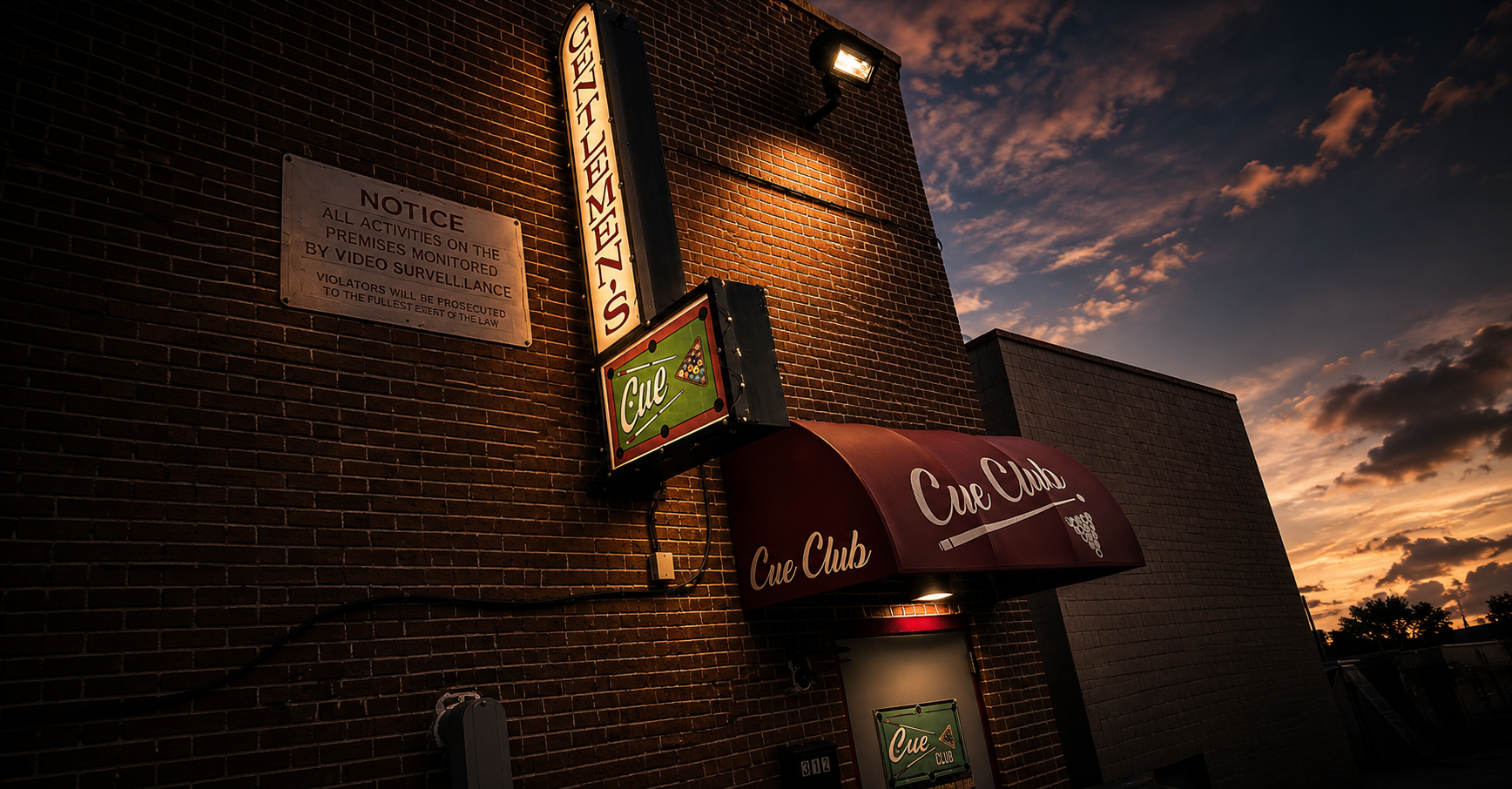 Gentlemen's Cue Club exterior at sunset